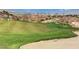 Beautiful golf course with sand trap and city skyline in the distance at 2728 Goldcreek St, Henderson, NV 89052