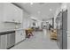 Bright, open kitchen flows into the living space, featuring modern appliances and white cabinetry at 2728 Goldcreek St, Henderson, NV 89052