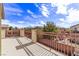 Relaxing balcony showcasing a wrought-iron railing and neighborhood views at 3009 Little Crimson Ave, North Las Vegas, NV 89081