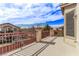 Outdoor balcony with tan railing offering beautiful views of the surrounding neighborhood and bright sky at 3009 Little Crimson Ave, North Las Vegas, NV 89081