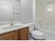 Cozy bathroom featuring a single sink vanity with wood cabinets and a shower-tub combo at 3009 Little Crimson Ave, North Las Vegas, NV 89081