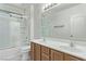 Bathroom with double vanity, shower-tub combo, and neutral decor at 3009 Little Crimson Ave, North Las Vegas, NV 89081