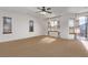 Spacious bedroom filled with natural light from the multiple windows and sliding glass door to balcony at 3009 Little Crimson Ave, North Las Vegas, NV 89081