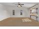 Bright primary bedroom featuring neutral carpet, large closet and natural light from windows and door at 3009 Little Crimson Ave, North Las Vegas, NV 89081