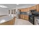 Updated kitchen featuring stainless steel appliances, granite countertops and wood cabinets at 3009 Little Crimson Ave, North Las Vegas, NV 89081