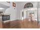 Spacious living room with hardwood floors, a fireplace, and elegant architectural details at 3009 Little Crimson Ave, North Las Vegas, NV 89081