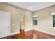 Light-filled bedroom with hardwood floors, neutral walls, and a recessed ceiling at 32 Hunting Horn Dr, Las Vegas, NV 89135