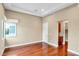 Light-filled bedroom features hardwood floors, neutral walls, and a recessed ceiling at 32 Hunting Horn Dr, Las Vegas, NV 89135