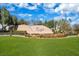 Stone sign for The Ridges community with manicured landscaping and green grass, inviting residents and guests at 32 Hunting Horn Dr, Las Vegas, NV 89135