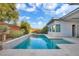 Inviting pool area set against a beautifully landscaped backyard at 32 Hunting Horn Dr, Las Vegas, NV 89135