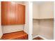 Spacious walk-in closet features custom wood cabinets and built-in storage at 32 Hunting Horn Dr, Las Vegas, NV 89135