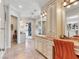 Bathroom featuring a large vanity with marble countertops, a dressing table and access to two walk-in closets at 330 Rancho Cir, Las Vegas, NV 89107