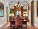 Formal dining room featuring a grand chandelier, hardwood floors and elegant decor at 330 Rancho Cir, Las Vegas, NV 89107