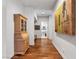 Hallway featuring hardwood floors and custom cabinetry on either side at 330 Rancho Cir, Las Vegas, NV 89107