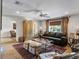 Cozy living room with a leather sofa, hardwood floors and a large window at 330 Rancho Cir, Las Vegas, NV 89107