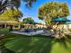 Inviting pool area with comfortable lounge chairs and umbrellas for ultimate relaxation at 330 Rancho Cir, Las Vegas, NV 89107