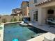 Beautiful backyard with pool, patio, and covered seating area, ideal for entertaining at 4138 Bayley Skye Ave, Las Vegas, NV 89141