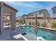 Spacious backyard featuring a sparkling pool, patio, and stylish outdoor furniture set at 4138 Bayley Skye Ave, Las Vegas, NV 89141