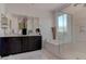 Modern bathroom featuring a double vanity, soaking tub, and glass-enclosed shower at 4138 Bayley Skye Ave, Las Vegas, NV 89141