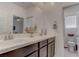 Bathroom featuring double sinks and modern fixtures at 4138 Bayley Skye Ave, Las Vegas, NV 89141