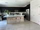 Spacious kitchen featuring black cabinetry, a large island, and modern stainless steel appliances at 4138 Bayley Skye Ave, Las Vegas, NV 89141