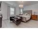 Main bedroom featuring modern decor, natural light, and wood-look flooring at 4138 Bayley Skye Ave, Las Vegas, NV 89141