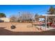 Large backyard featuring a covered patio, fire pit, and room for activities at 432 Bonelli Ave, Overton, NV 89040