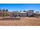 Large backyard featuring a covered patio, perfect for outdoor dining and relaxation at 432 Bonelli Ave, Overton, NV 89040