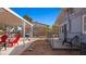 Relaxing backyard with covered patio, chairs, and grill ready for outdoor living at 432 Bonelli Ave, Overton, NV 89040