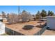 Large backyard featuring a trampoline, a covered patio, mature trees, and ample space for activities at 432 Bonelli Ave, Overton, NV 89040