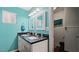 Bright bathroom featuring double sinks with black countertop at 432 Bonelli Ave, Overton, NV 89040