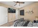 Staged bedroom with a bed, ceiling fan, and mounted television at 432 Bonelli Ave, Overton, NV 89040
