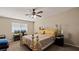 Bedroom featuring a ceiling fan, a window, and a bed at 432 Bonelli Ave, Overton, NV 89040