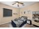 Charming bedroom featuring a ceiling fan and playful decor at 432 Bonelli Ave, Overton, NV 89040