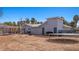 Exterior view showcasing a large backyard with covered patio and trampoline at 432 Bonelli Ave, Overton, NV 89040