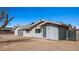 Charming single-story home featuring gray siding, a metal roof, a one-car garage, and a fenced yard at 432 Bonelli Ave, Overton, NV 89040