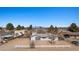 Single-story home with a metal roof, a fenced yard and desert landscaping at 432 Bonelli Ave, Overton, NV 89040