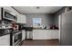 Well-lit kitchen features stainless steel appliances, dark countertops, and white cabinets at 432 Bonelli Ave, Overton, NV 89040