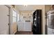 Bright laundry room with washer, dryer, shelving, and storage space at 432 Bonelli Ave, Overton, NV 89040