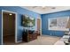 Living room featuring a wall-mounted TV, and connections to adjacent rooms at 432 Bonelli Ave, Overton, NV 89040