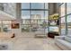 Bright living room featuring a massive window wall, and a large sectional sofa at 4515 Dean Martin Dr # 200, Las Vegas, NV 89103