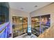 Upper-level living room with large windows providing a cityscape view at night at 4515 Dean Martin Dr # 200, Las Vegas, NV 89103