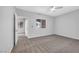 Bedroom featuring a ceiling fan, large window, and doorway to another room at 4655 Gold Dust Ave # 139, Las Vegas, NV 89120