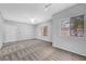 Well-lit living room with neutral paint, carpet, two windows and a front door at 4655 Gold Dust Ave # 139, Las Vegas, NV 89120