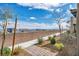 A landscaped backyard featuring a sidewalk and desert landscaping at 500 Pear Lake St, Las Vegas, NV 89138