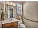 Well-lit powder room with modern fixtures, including a quartz countertop and sleek towel bar at 500 Pear Lake St, Las Vegas, NV 89138