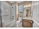 Well-lit bathroom featuring shower-tub combination, toilet and vanity at 500 Pear Lake St, Las Vegas, NV 89138