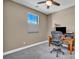 Cozy bedroom featuring a ceiling fan, natural light from the window and a desk area for study and work at 500 Pear Lake St, Las Vegas, NV 89138