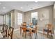 Well-lit dining area with wood floors and table setting for a dinner with Gathering and friends at 500 Pear Lake St, Las Vegas, NV 89138