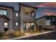 Modern two-story home with attractive landscaping, a private balcony, and an inviting entrance at 500 Pear Lake St, Las Vegas, NV 89138